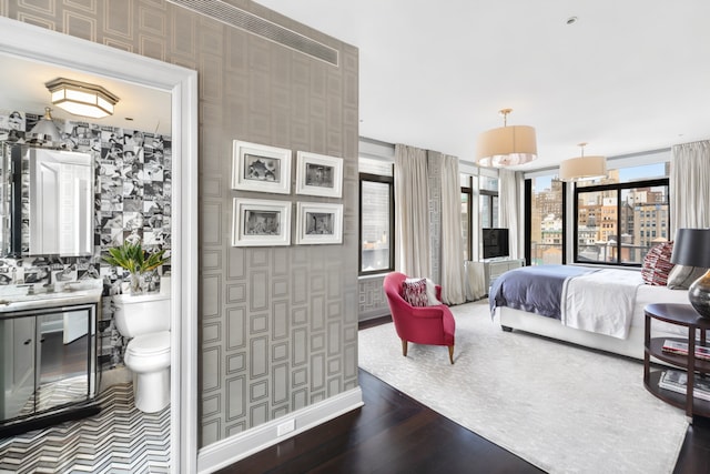 45 E 30th St Phb, Phb, New York City, NY 10016 - bedroom with wood finished floors, ensuite bathroom, and wallpapered walls