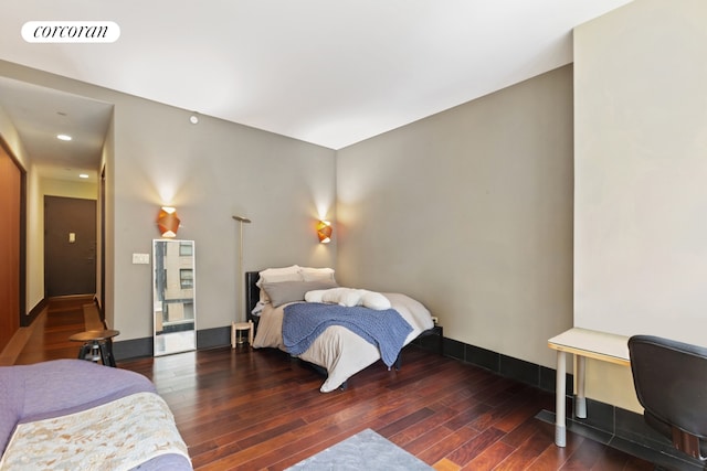 40 Broad St Unit 18C, New York City, NY 10004 - bedroom with hardwood / wood-style flooring, baseboards, and recessed lighting