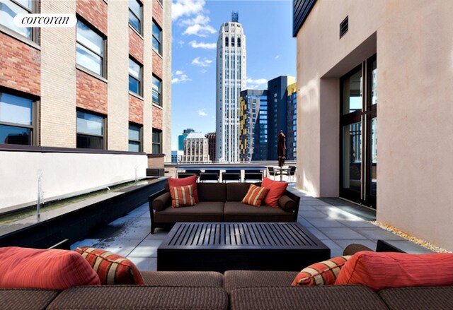 40 Broad St Unit 18C, New York City, NY 10004 - view of patio with an outdoor living space and a skyline view
