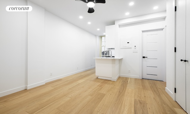 509 E 77th St Unit 1P, New York City, NY 10075 - spare room with a ceiling fan, light wood-style flooring, recessed lighting, baseboards, and electric panel