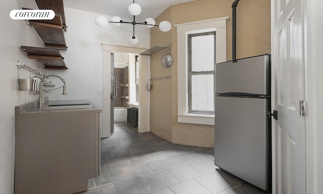 107 W 106th St Unit A, New York City, NY 10025 - kitchen featuring freestanding refrigerator, a sink, and a chandelier