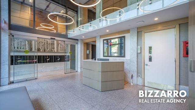 302 E 96th St Unit 502, New York City, NY 10128 - welcome area featuring a high ceiling, mail area, and recessed lighting
