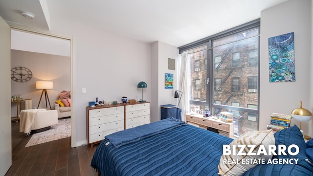 302 E 96th St Unit 502, New York City, NY 10128 - bedroom with dark wood-style flooring and floor to ceiling windows