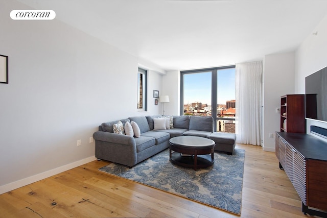 23 W 116th St Unit 11A, New York City, NY 10026 - living room with light wood-style floors and baseboards