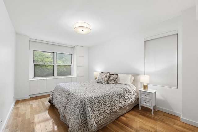310 E 49th St Unit 4-D, New York City, NY 10017 - bedroom with hardwood / wood-style floors and baseboards