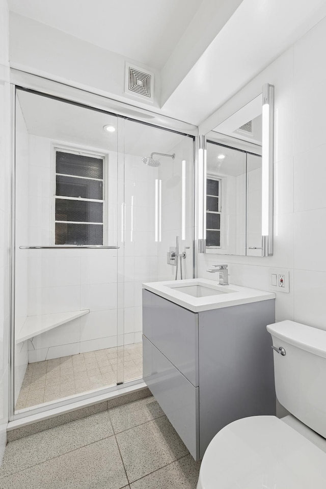 310 E 49th St Unit 4-D, New York City, NY 10017 - bathroom featuring toilet, a stall shower, and vanity