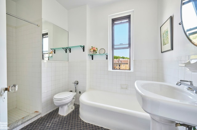 1825 Riverside Dr Unit 6B, New York City, NY 10034 - full bath with tile walls, toilet, a sink, shower / bath combination with curtain, and tile patterned flooring