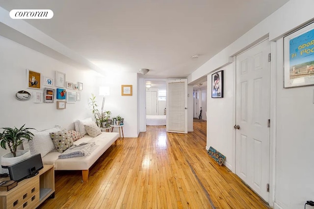 sitting room featuring light wood-type flooring