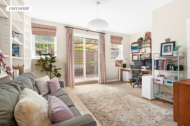 home office with tile patterned flooring and baseboards