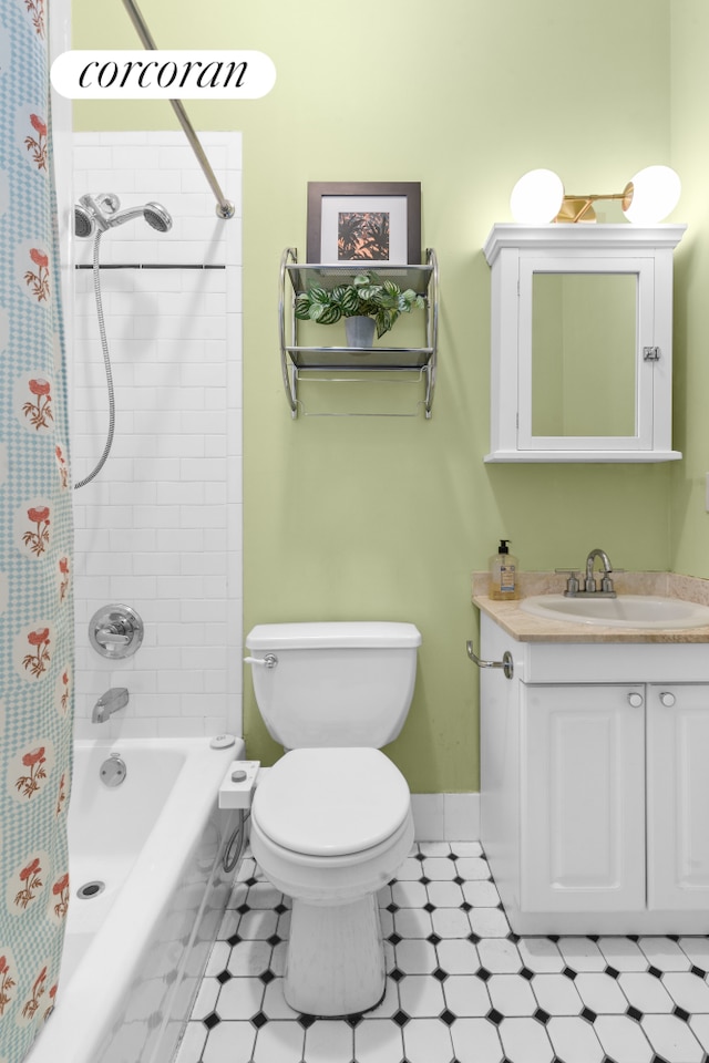 bathroom with toilet, shower / tub combo, vanity, and baseboards