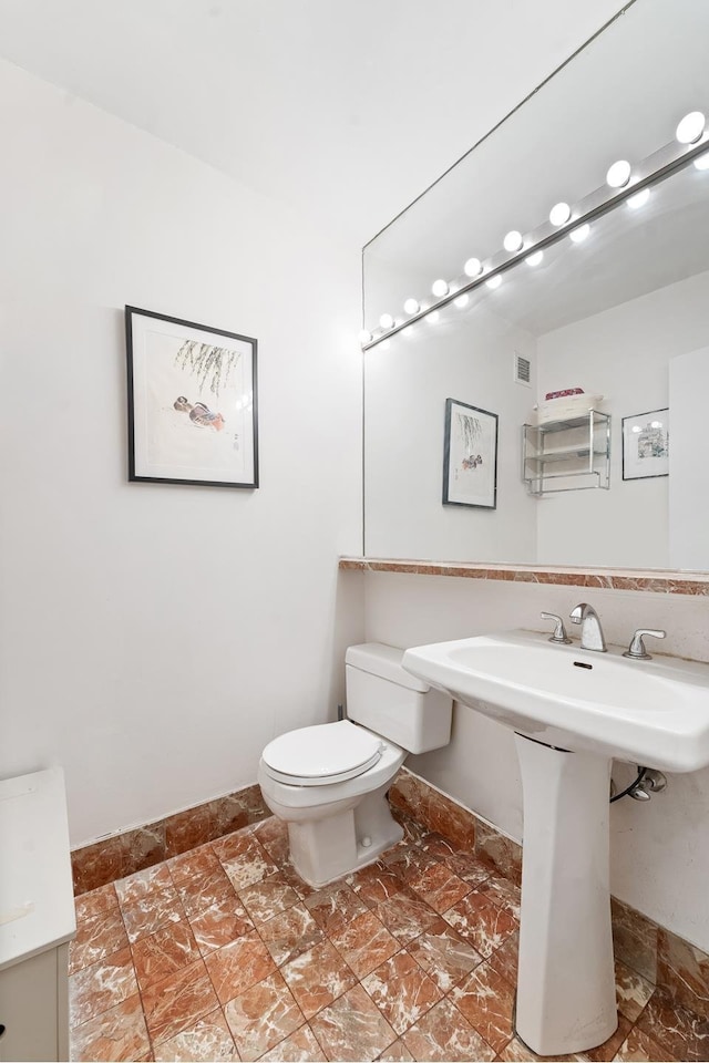 245 E 93rd St Unit 22C, New York City, NY 10128 - half bathroom featuring toilet