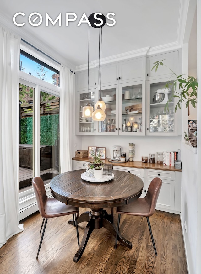255 W 95th St Unit 6D, New York City, NY 10025 - dining area featuring light wood finished floors and crown molding