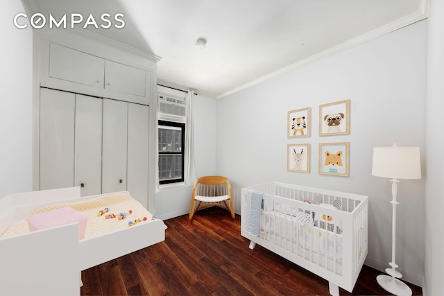 255 W 95th St Unit 6D, New York City, NY 10025 - bedroom with crown molding, dark wood finished floors, a nursery area, and a closet