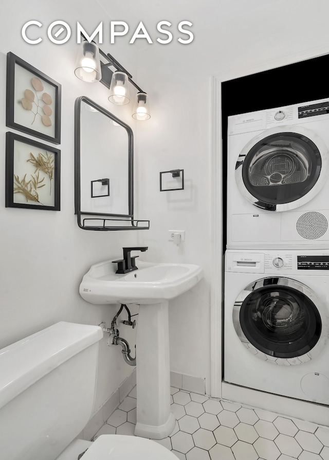255 W 95th St Unit 6D, New York City, NY 10025 - bathroom featuring stacked washer / drying machine and tile patterned floors