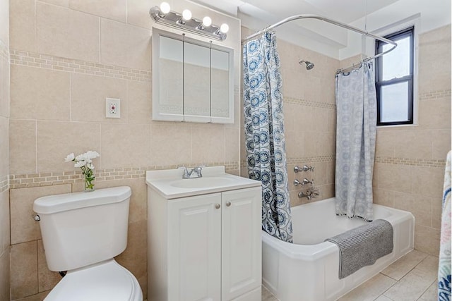 657 E 26th St Unit 4-K, New York City, NY 11210 - bathroom featuring tile walls, shower / bathtub combination with curtain, vanity, and tile patterned floors