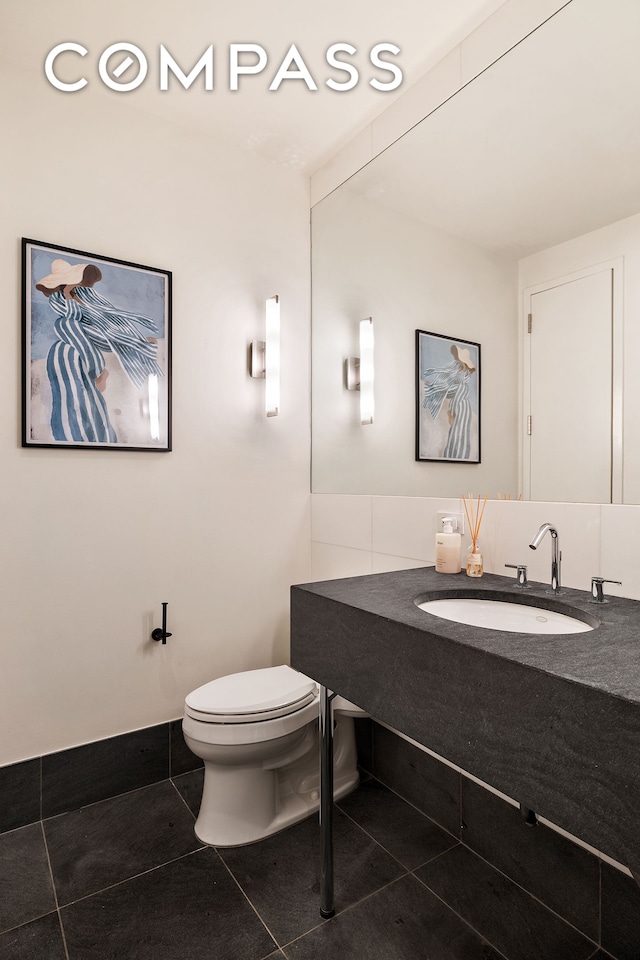 4 W 21st St Unit 2D, New York City, NY 10010 - half bathroom with vanity and tile patterned floors