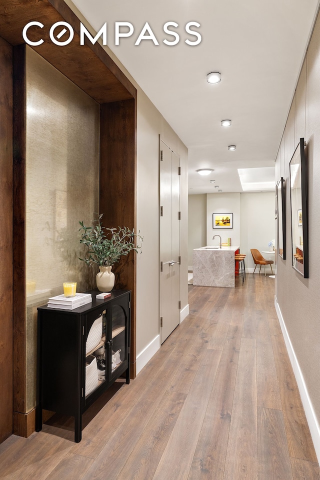 4 W 21st St Unit 2D, New York City, NY 10010 - hallway with light wood finished floors and baseboards