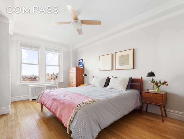 39 Plaza St W Unit 7C, New York City, NY 11217 - bedroom featuring radiator heating unit, baseboards, and hardwood / wood-style flooring