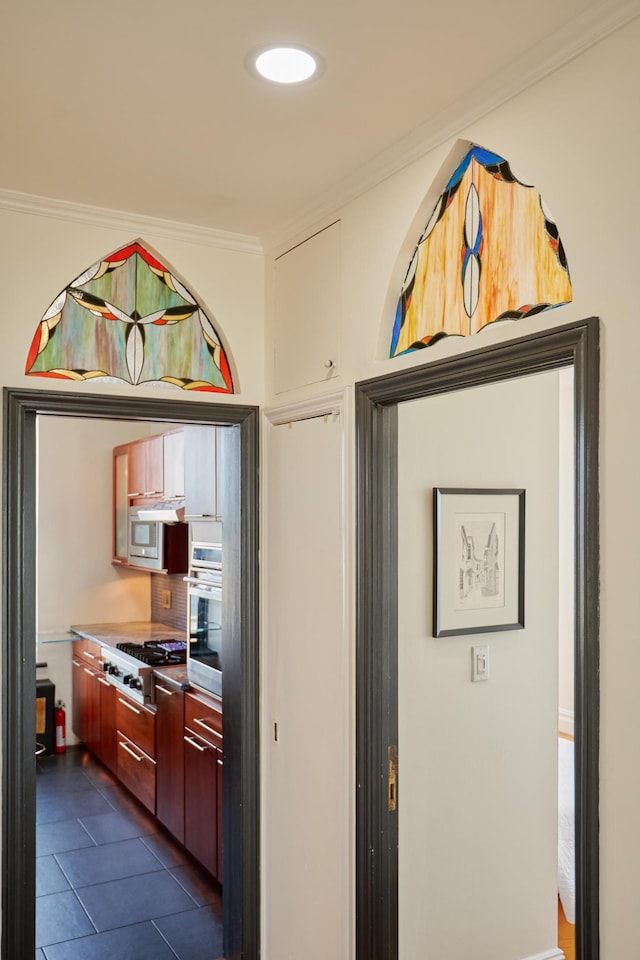 75 Livingston St Unit 28-A, New York City, NY 11201 - kitchen with appliances with stainless steel finishes, crown molding, and dark tile patterned floors