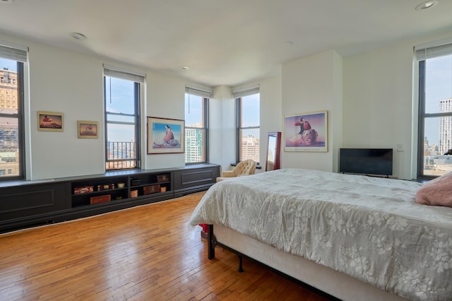 75 Livingston St Unit 28-A, New York City, NY 11201 - bedroom featuring multiple windows, wood-type flooring, and recessed lighting