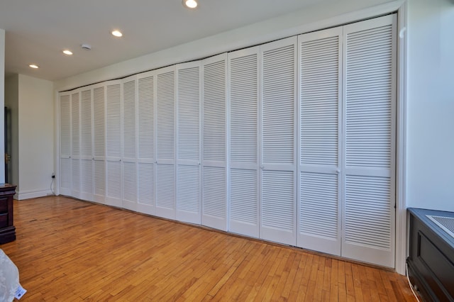 75 Livingston St Unit 28-A, New York City, NY 11201 - unfurnished bedroom featuring recessed lighting, light wood-style floors, and a closet