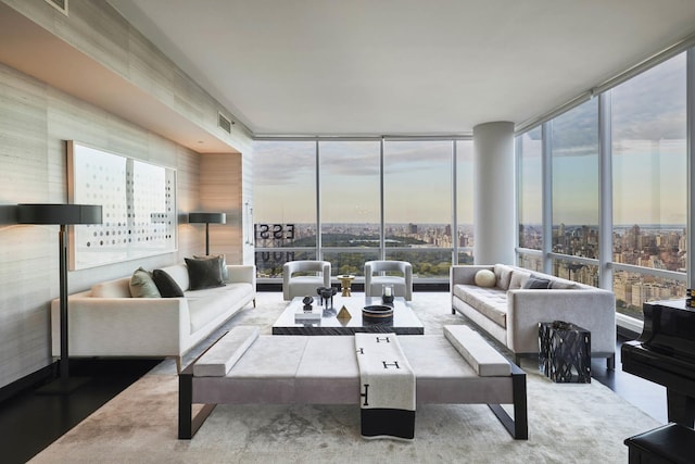 157 W 57th St Unit 51-C, New York City, NY 10019 - living room featuring expansive windows, plenty of natural light, and a view of city