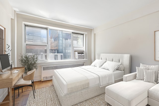 288 Lexington Ave Unit 6C, New York City, NY 10016 - bedroom with radiator heating unit, cooling unit, and a desk
