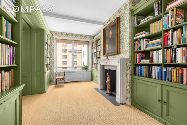 575 Park Ave Unit 608/609, New York City, NY 10065 - living area featuring wallpapered walls, a fireplace with flush hearth, and light carpet