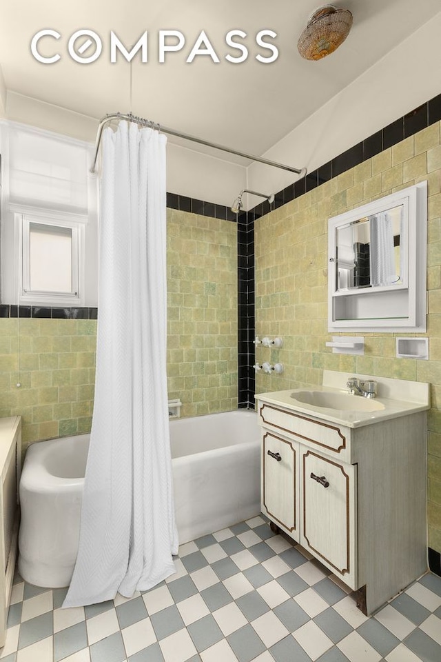 575 Park Ave Unit 608/609, New York City, NY 10065 - full bathroom with tile patterned floors, shower / bath combo, vanity, and tile walls