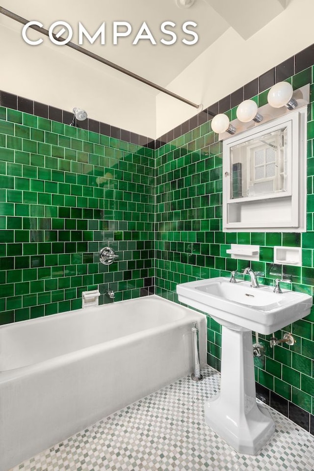 575 Park Ave Unit 608/609, New York City, NY 10065 - full bath with tile walls, washtub / shower combination, and a sink
