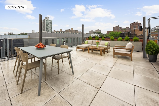 123 Clinton Ave Unit 4B, New York City, NY 11205 - view of patio / terrace featuring a view of skyline, outdoor lounge area, and outdoor dining space