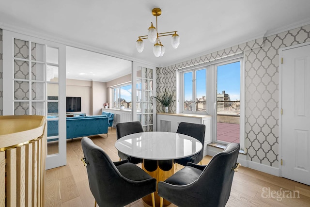 166 E 63rd St Unit 20A, New York City, NY 10065 - dining space featuring wallpapered walls, light wood-type flooring, crown molding, and baseboards