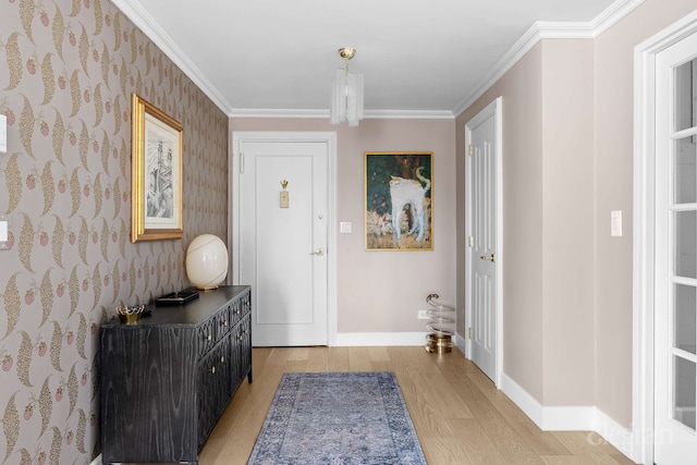 166 E 63rd St Unit 20A, New York City, NY 10065 - foyer entrance with light wood finished floors, baseboards, crown molding, and wallpapered walls