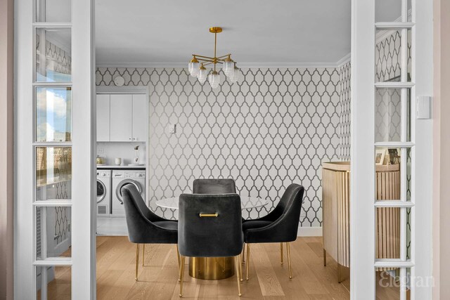 166 E 63rd St Unit 20A, New York City, NY 10065 - dining area with ornamental molding, wallpapered walls, separate washer and dryer, and light wood finished floors