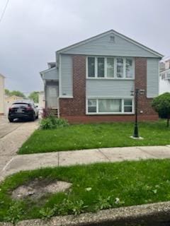 10567 Flatlands 7th St, New York City, NY 11236 - view of front facade with brick siding and driveway
