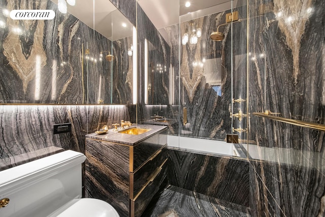 180 W 58th St Unit 5F, New York City, NY 10019 - full bath featuring toilet, a tub with marble appearance, a marble finish shower, vanity, and tile walls
