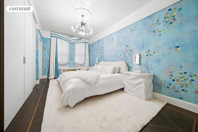 180 W 58th St Unit 5F, New York City, NY 10019 - bedroom with wallpapered walls, baseboards, and a chandelier