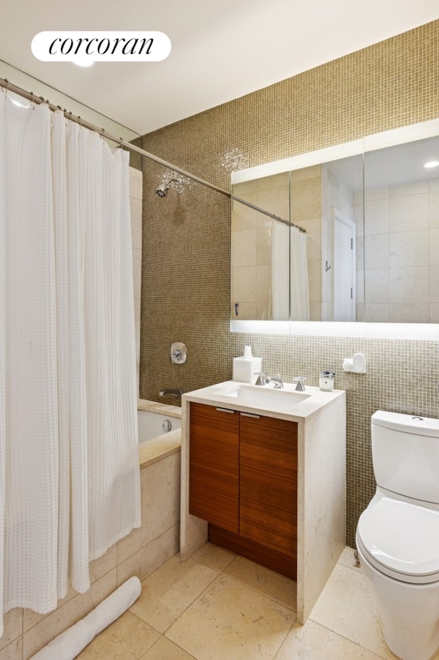 70 Little W St Unit 6J, New York City, NY 10280 - full bathroom featuring tile walls, tiled shower / bath, vanity, and tile patterned flooring