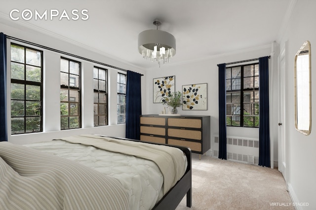 116 Pinehurst Ave Unit H32, New York City, NY 10033 - bedroom with radiator, a chandelier, crown molding, carpet, and multiple windows