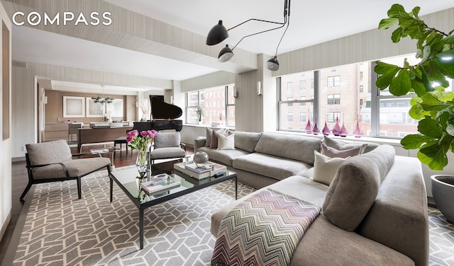 45 E 72nd St Unit 9Bc, New York City, NY 10021 - living area with brick patterned flooring, wallpapered walls, and a chandelier