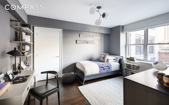 45 E 72nd St Unit 9Bc, New York City, NY 10021 - bedroom with dark wood-style flooring and an office area