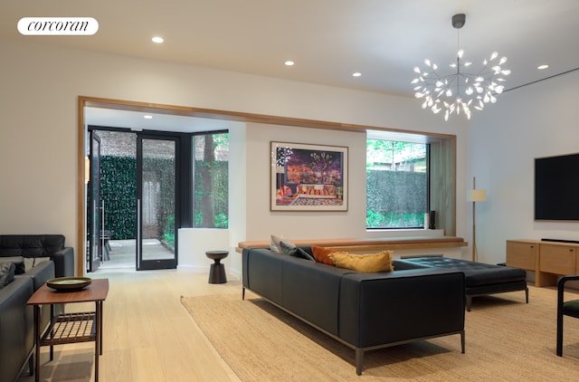 234 E 46th St Unit 1505, New York City, NY 10017 - living room featuring wood finished floors, recessed lighting, and a chandelier