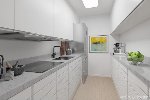 77 W 55th St Unit 7F, New York City, NY 10019 - kitchen featuring black electric cooktop, white cabinetry, wall chimney exhaust hood, light stone counters, and modern cabinets