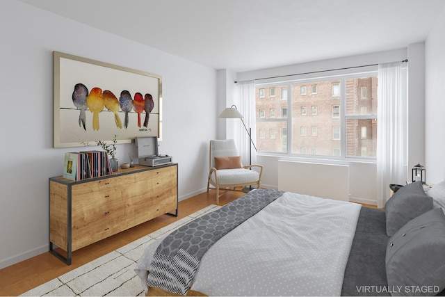 77 W 55th St Unit 7F, New York City, NY 10019 - bedroom with wood finished floors