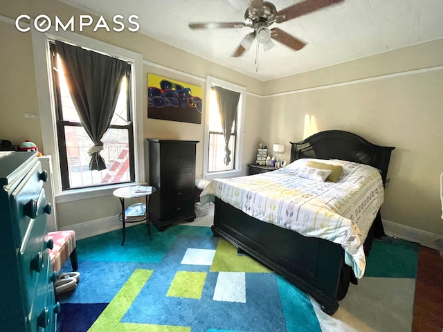 25-21 23rd St Unit 24, New York City, NY 11102 - carpeted bedroom featuring baseboards and ceiling fan