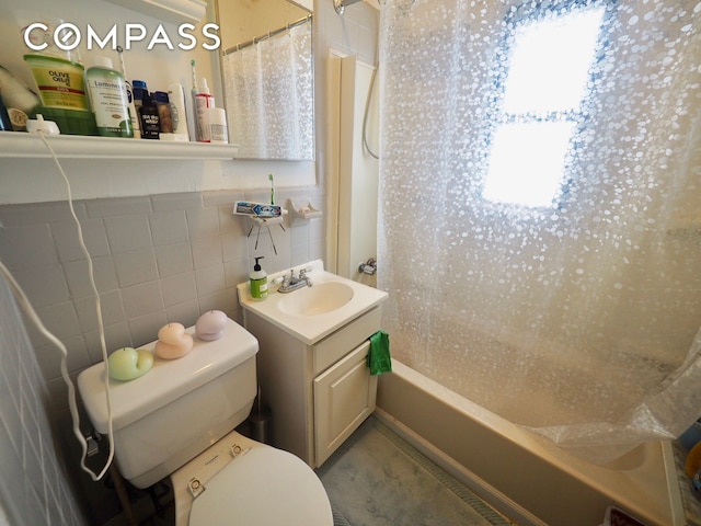 25-21 23rd St Unit 24, New York City, NY 11102 - full bathroom with toilet, healthy amount of natural light, shower / bath combo, vanity, and tile walls