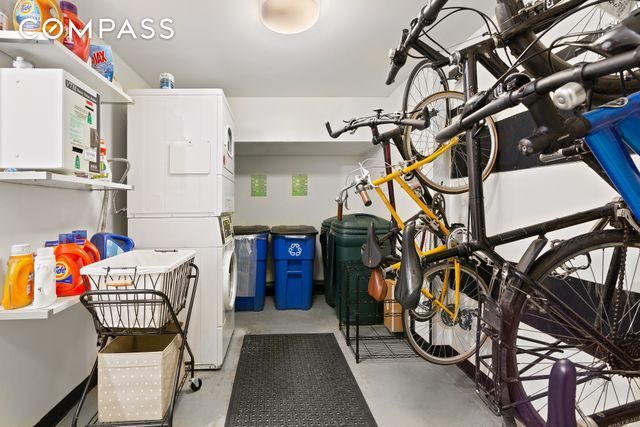 569 Carroll St Unit 9, New York City, NY 11215 - garage featuring stacked washing machine and dryer