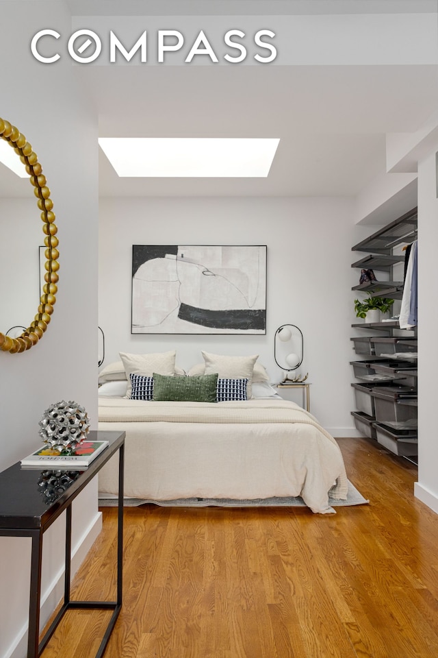569 Carroll St Unit 9, New York City, NY 11215 - bedroom featuring a skylight and wood finished floors