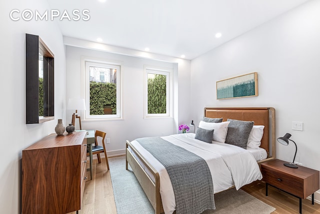 420 E 75th St Unit 3, New York City, NY 10021 - bedroom featuring light wood-style flooring, recessed lighting, and baseboards