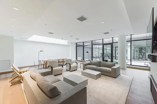 21-30 44th Dr Unit 7C, New York City, NY 11101 - building lobby with a wall of windows and recessed lighting